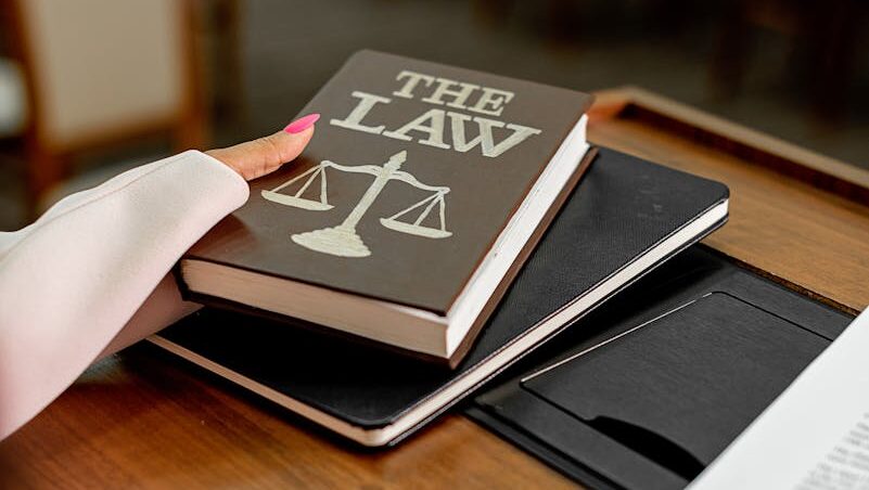 Close-up of a law book on a podium in a conference setting, symbolizing legal knowledge.